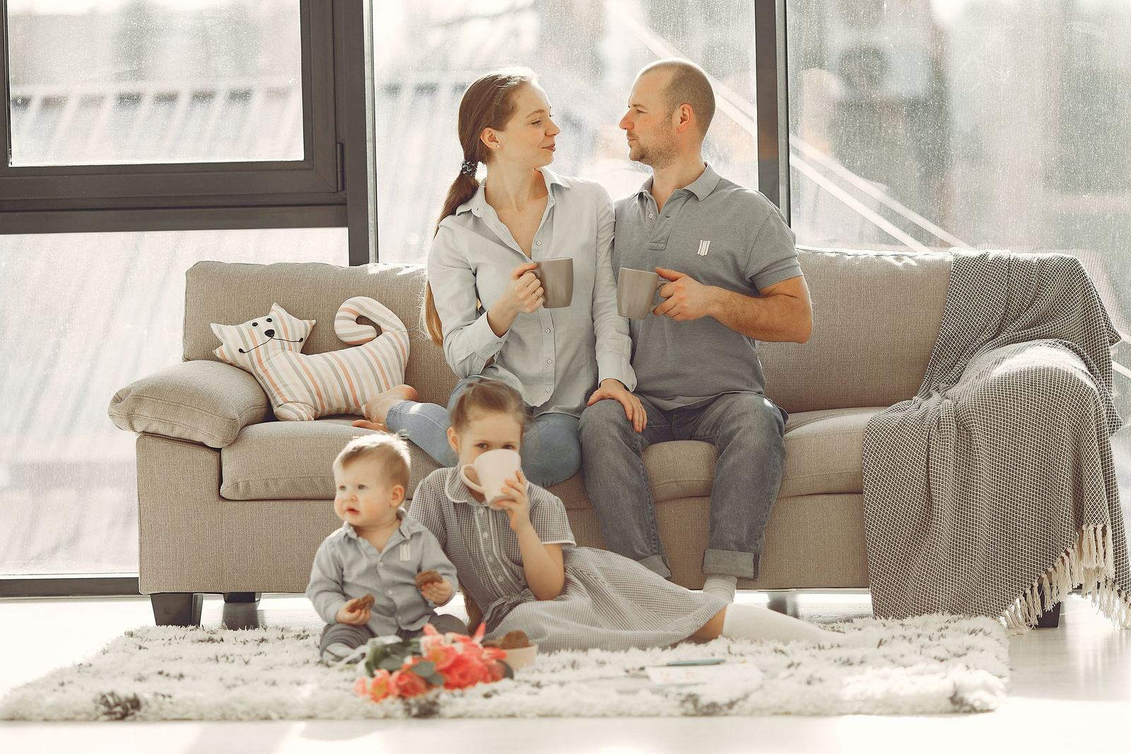 Family relaxing together on a living room couch