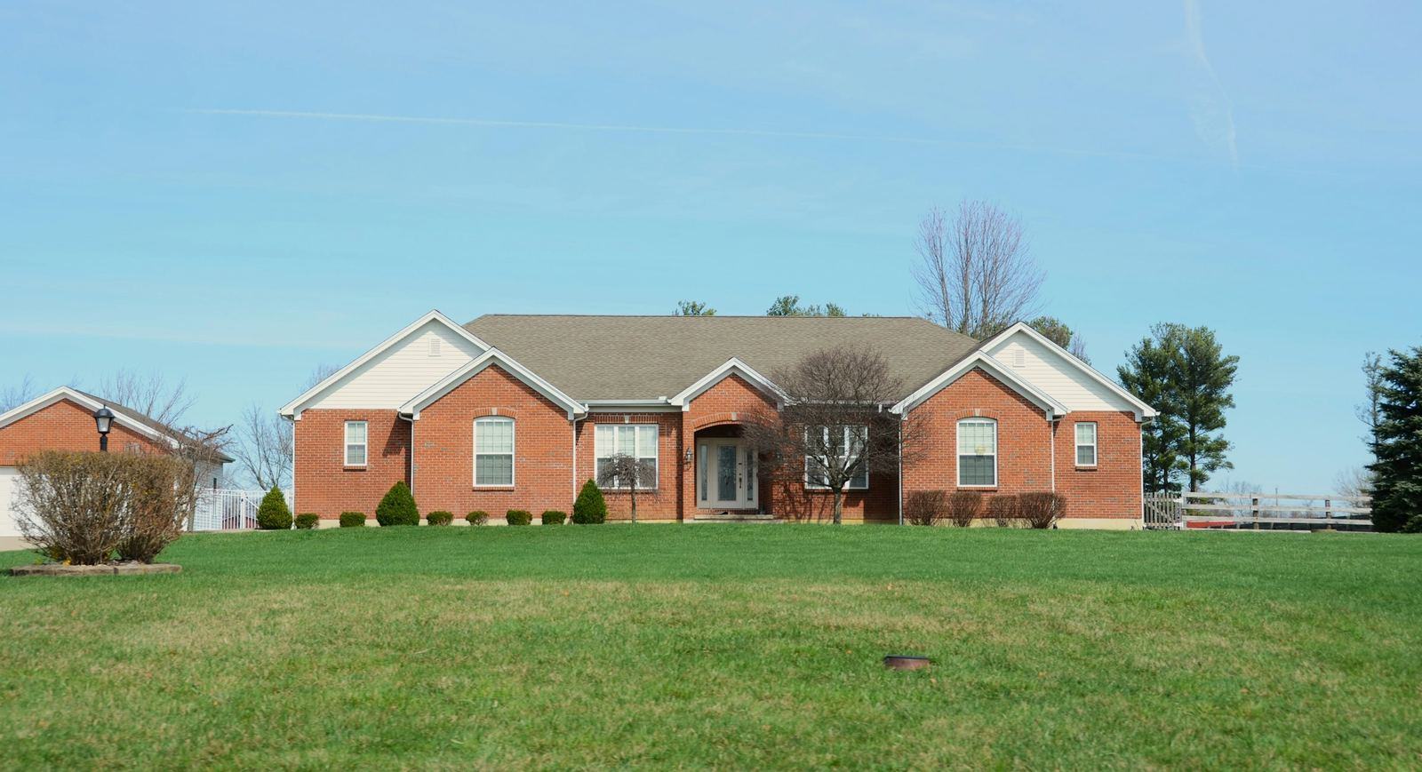 Brick ranch home with a wide lawn